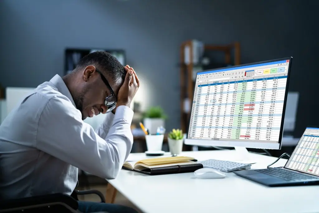 Stressed,Depressed,African,Man,At,Desk